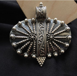 Tribal oval silver pendant