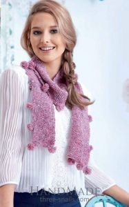Women knitted scarf with pom poms